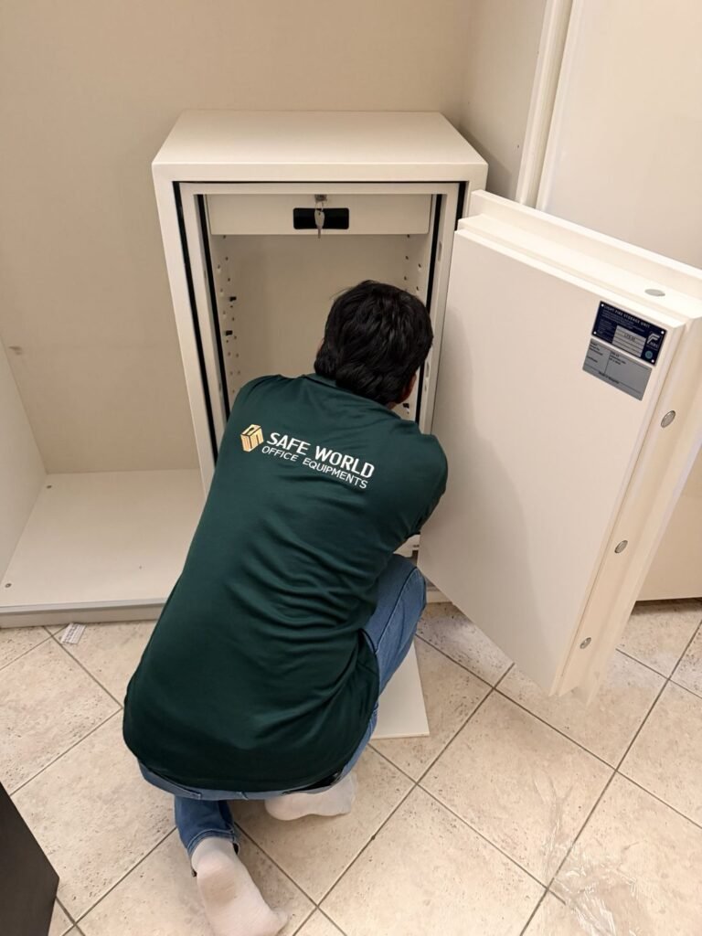 Safe World technician installing a fire-resistant safe at a home in Abu Dhabi